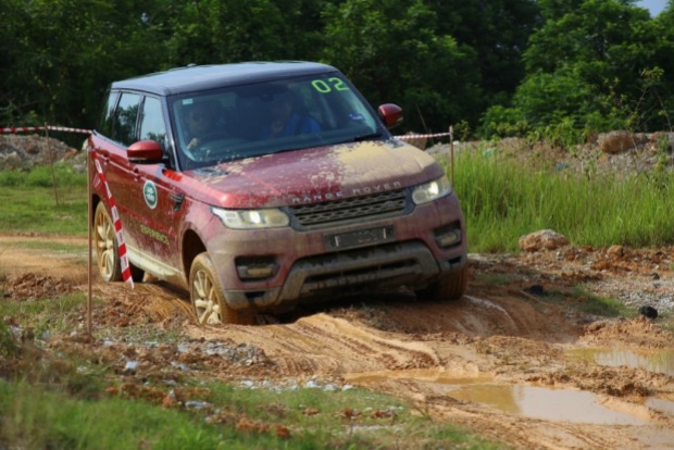 A Range Rover Sport taking on elephant steps with aplomb